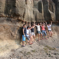 Visitors standing in front of the palaeo-soil layer at Penghu Marine Geopark